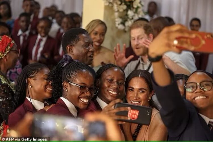 Photo of Meghan Markel wearing sleeveless beige dress on her first visit to Nigeria with Prince Harry - Fashion police Nigeria