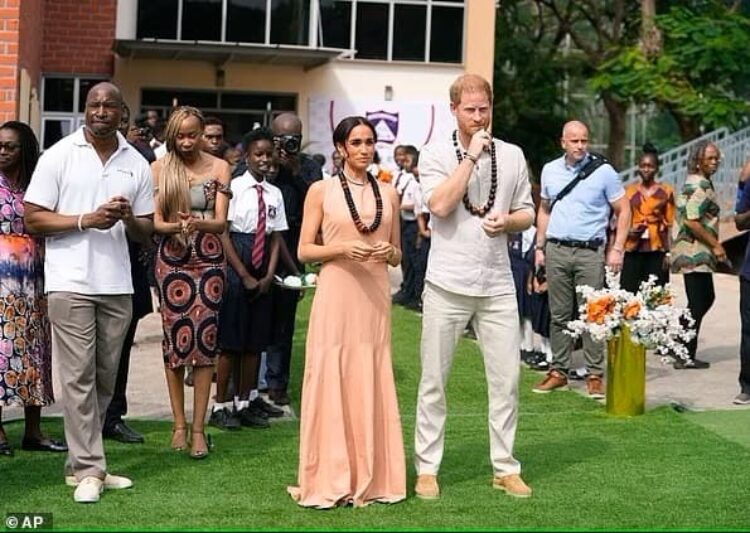 Photo of Meghan Markel wearing sleeveless beige dress on her first visit to Nigeria with Prince Harry - Fashion police Nigeria