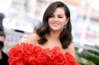 Selena Gomez is Pretty in a Red Off-The-Shoulder Dress with Roses in Cannes