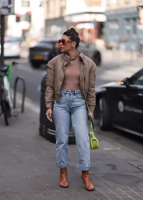 Photo of a woman wearing mom's jeans with a jacket