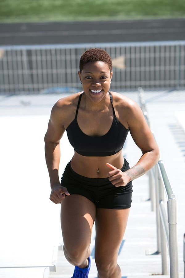 African American woman running or jogging during an outdoor exercise - Fashion Police Nigeria