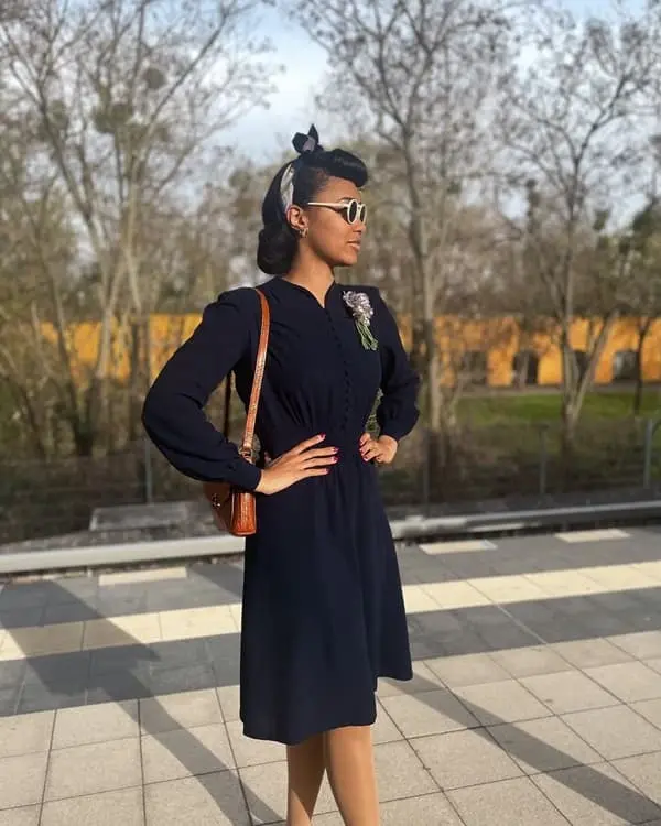 Photo of a beautiful African woman wearing a black vintage dress - Fashion Police Nigeria