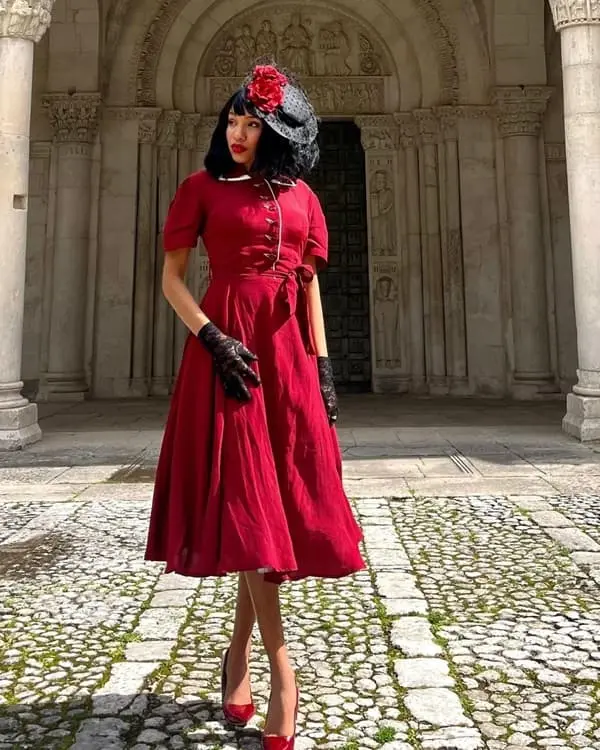 Photo of a beautiful African woman wearing a red vintage dress with headpiece - Fashion Police Nigeria