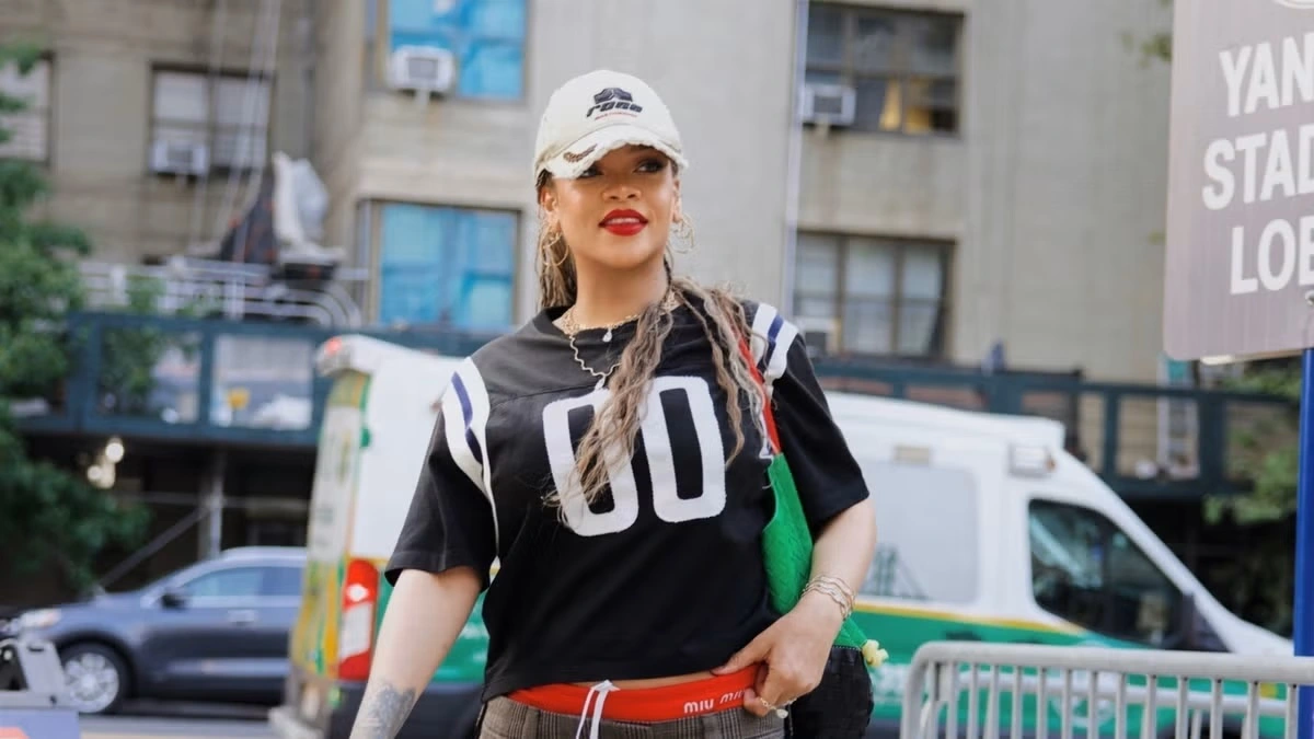 Rihanna sporty chic in black jersey and Miu Miu Mini skirt - Fashion Police Nigeria