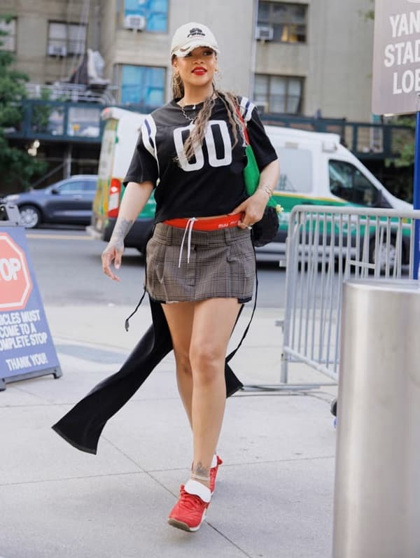 Rihanna sporty chic in black jersey and Miu Miu Mini skirt - Fashion Police Nigeria