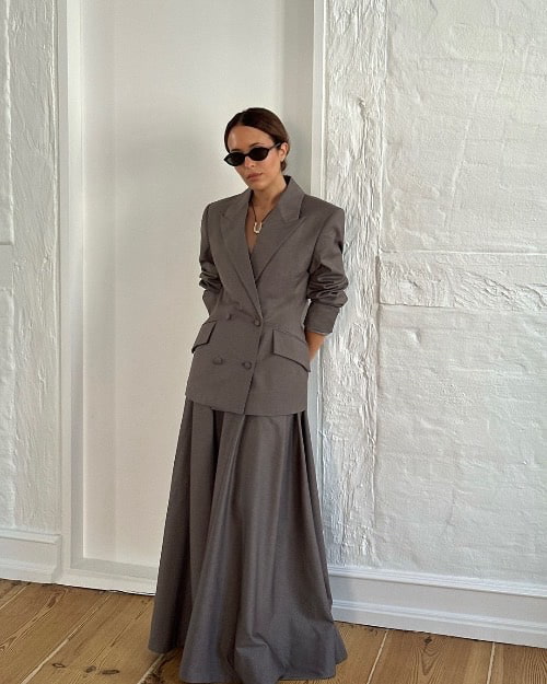 Photo of a woman on a charcoal grey suit - Fashion Police Nigeria