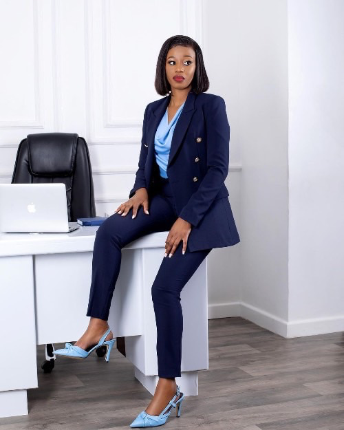 Photo of a woman on a navy blue suit - Fashion Police Nigeria