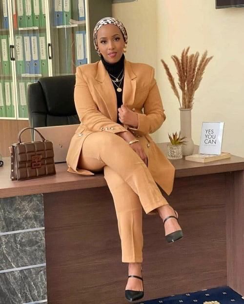 Photo of a woman on a tan suit - Fashion Police Nigeria