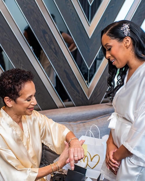 A beautiful photo of mother with her bride daughter praying together