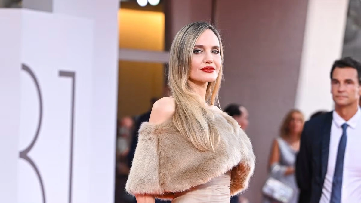 Photo of Angelina Jolie exuding pure elegance in a draped gown and fur wrap at Venice Film Festival 2024 - Fashion Police Nigeria