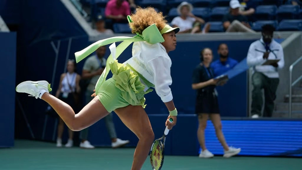 
Japan's Naomi Osaka warms up before her women's singles - Fashion Police Nigeria