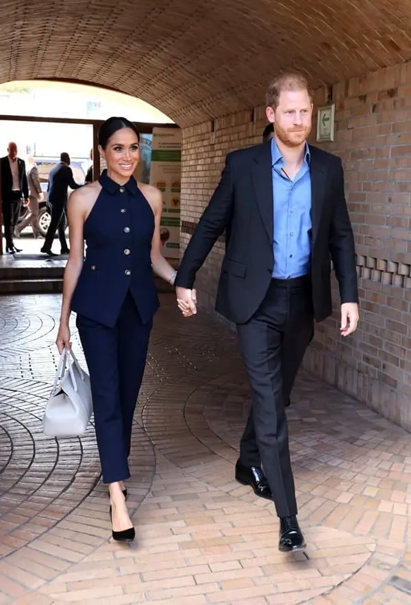 Meghan Markle made chic arrival in Colombia, wearing Veronica Beard sleeveless navy suit - Fashion Police Nigeria