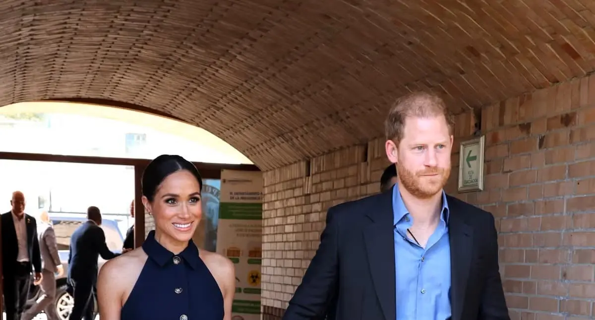 Meghan Markle made chic arrival in Colombia, wearing Veronica Beard sleeveless navy suit - Fashion Police Nigeria