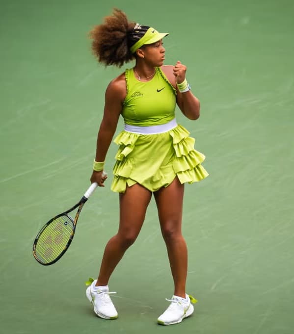 Japan's Naomi Osaka plays a forehand return against latvia's Jelena Ostapenko - Fashion Police Nigeria