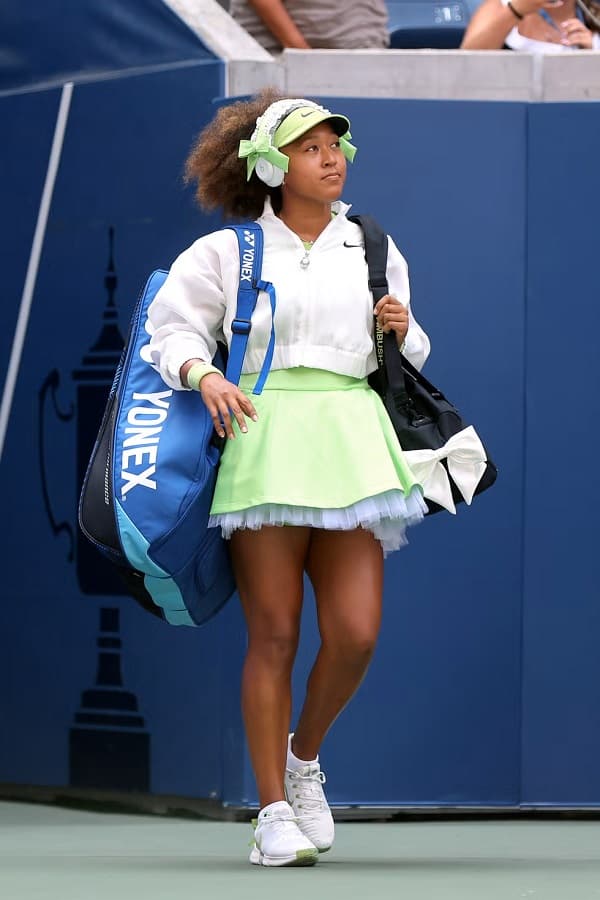 Naomi Osaka of Japan walks on court before playing against Jelena Ostapenko - Fashion Police Nigeria