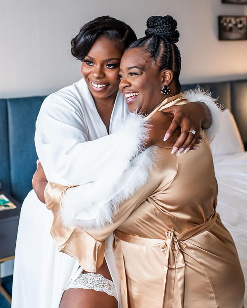 A beautiful photo of bride and mother sharing a hug on her bridal shower