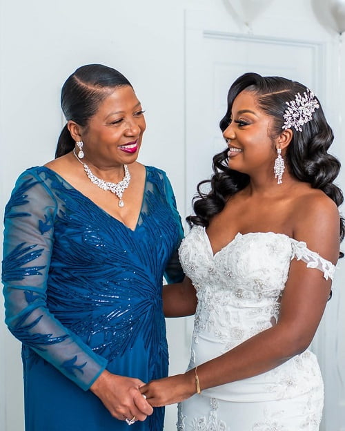 A beautiful photo of bride and mother smiling on the wedding day