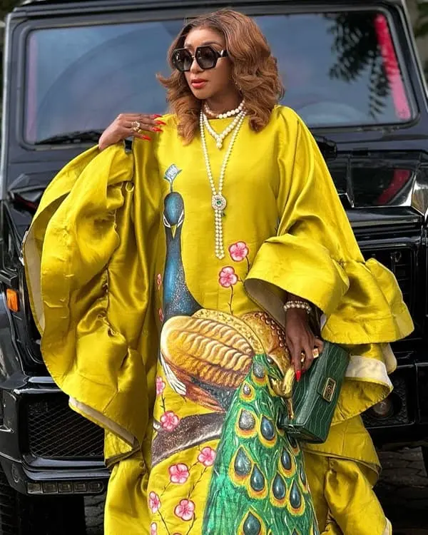 Ini Edo rich aunty yellow gown - Fashion Police Nigeria