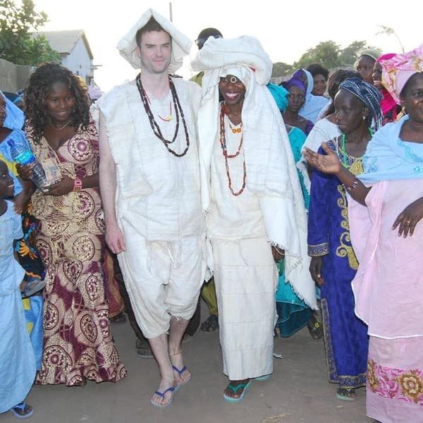 Photo of a Caucasian groom getting married to a Gambian bride during a traditional wedding - Fashion Police Nigeira