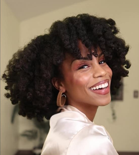 Black African American woman wearing her natural coily hair - Fashion Police Nigeria