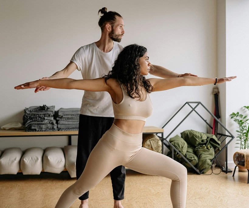 Woman exercising with her instructor