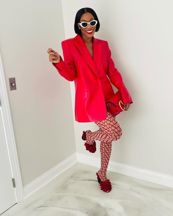 African fashion woman poses in a trendy red blazer and white framed sunglasses - Fashion Police Nigeria