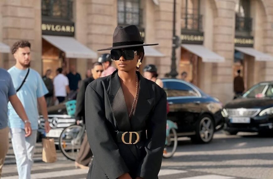 African fashion woman wears black blazer with matching hat on the street - Fashion Police Nigeria