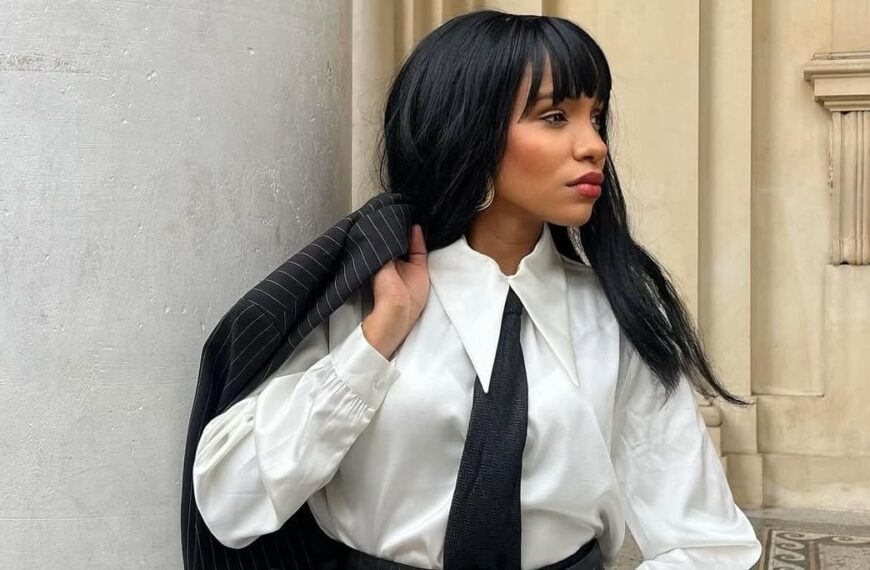 Fashion black African woman wears a long collar white shirt with a black tie for a chic corporate fashion - Fashion Police Nigeria