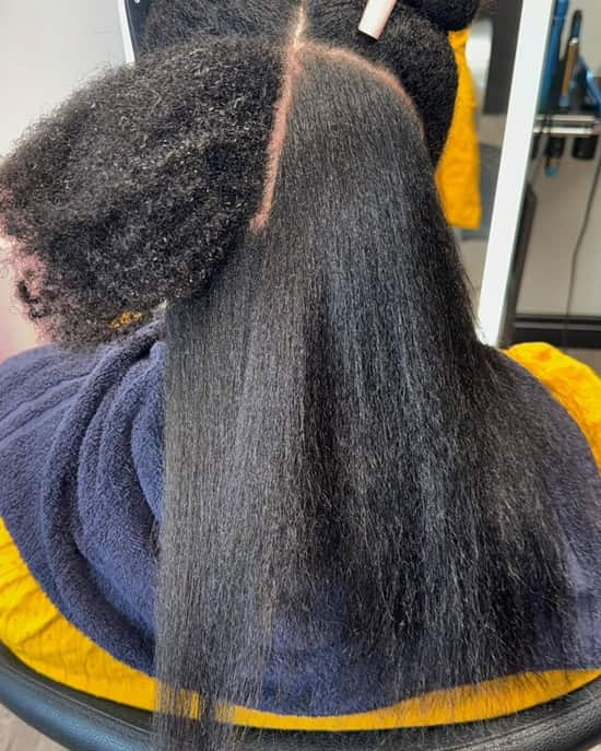 Black woman wears a silk press hair during a salon session - Fashion Police Nigeria