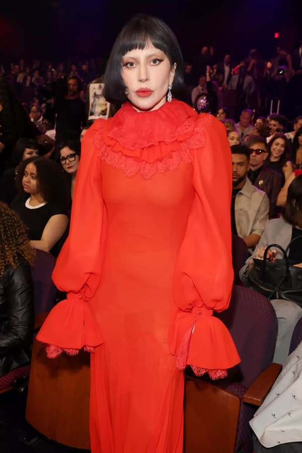 Lady Gaga, who opted for a long-sleeve red Alexander McQueen dress featuring a ruffled neckline and a small train at the 2025 iHeartRadio Music Awards - Fashion Police Nigeria