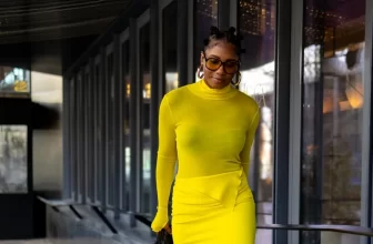 Photo of a African American woman wearing yellow and black monochrome matching set - Fashion Police Nigeria
