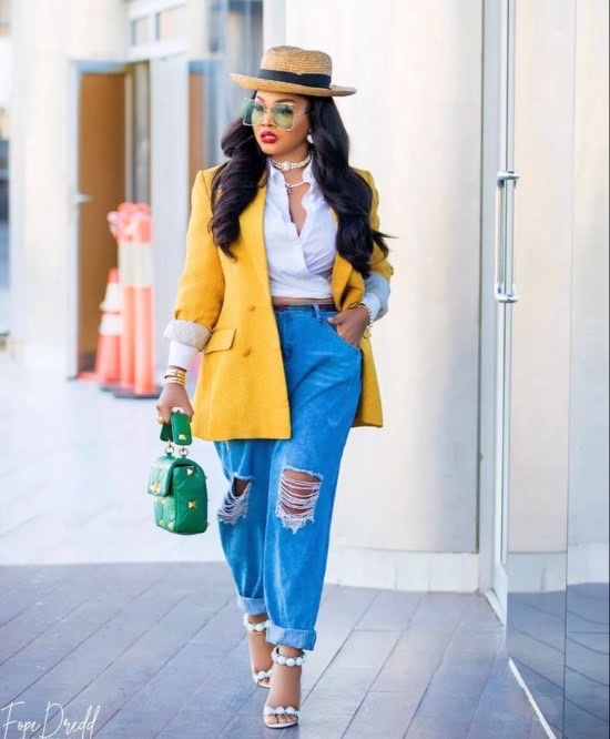 Fashion African American woman wearing an oversized yellow blazer with ripped denim pants - Fashion Police Nigeria
