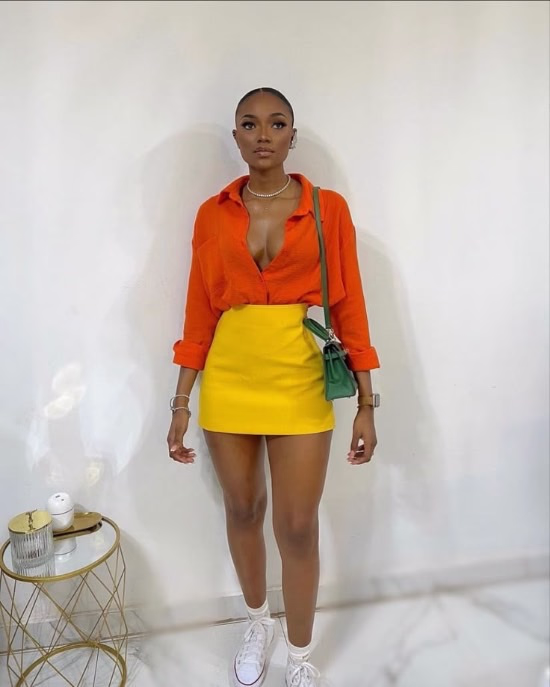Fashion woman wearing yellow mini skirt with orange tone shirt - Fashion Police Nigeria