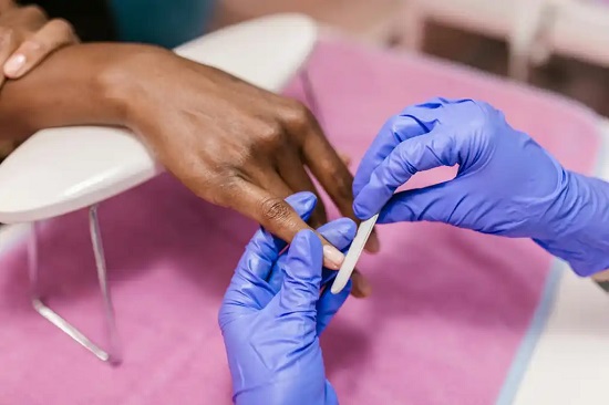 Photo of a person filing nails - Fashion Police Nigeria
