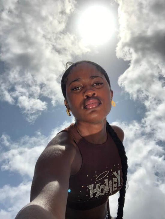 photo of a black lady taking selfies - Fashion Police Nigeria