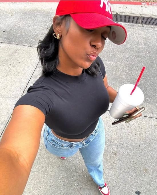 photo of a black lady taking selfies - Fashion Police Nigeria