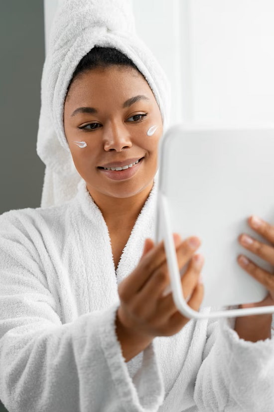 photo of woman smiling in front of a mirror -  Fashion Police Nigeria