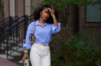 Photo of a lady dressed in a blue shirt and white trouser - Fashion Police Nigeria