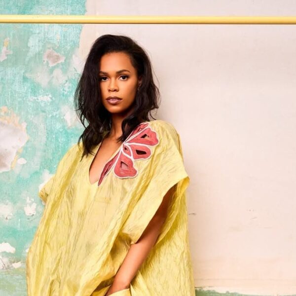 Model poses in Christie Brown yellow kaftan dress from the 2025 resort collection - Fashion Police Nigeria