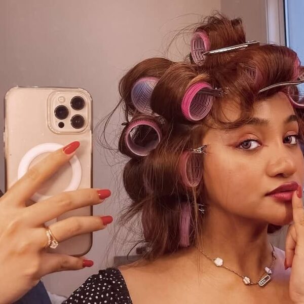 photo of a lady on heated rollers - Fashion Police Nigeria