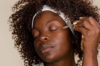 photo of a lady applying skin brightening serum on her face - Fashion Police Nigeria