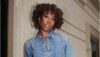 Photo of a beautiful African American woman wearing denim on denim and curly hair while leaning against the wall - Fashion Police Nigeria