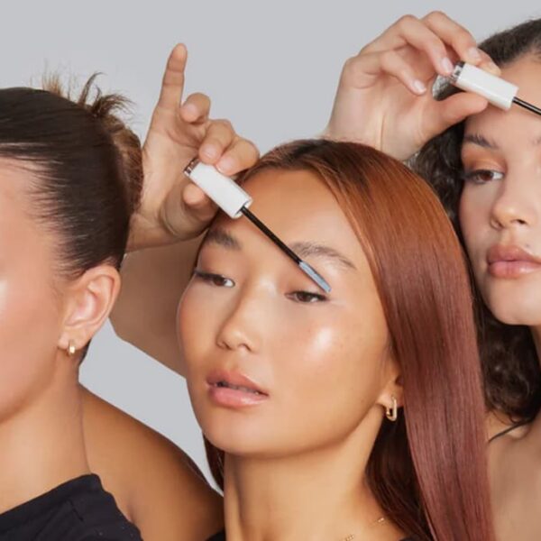 photo of three ladies using a spoolie to brush their brows