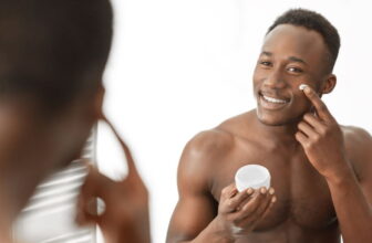 Men in front of the mirror creaming his face - Fashion Police Nigeria