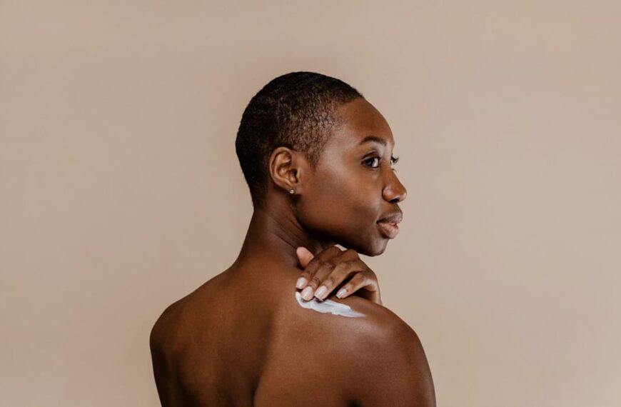 Photo of a model applying body lotion - Fashion Police Nigeria