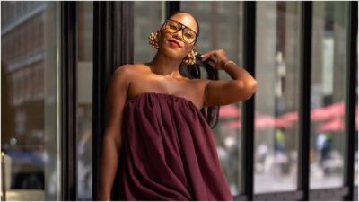 photo of a beautiful black laby on a wine sleeveless bubble dress