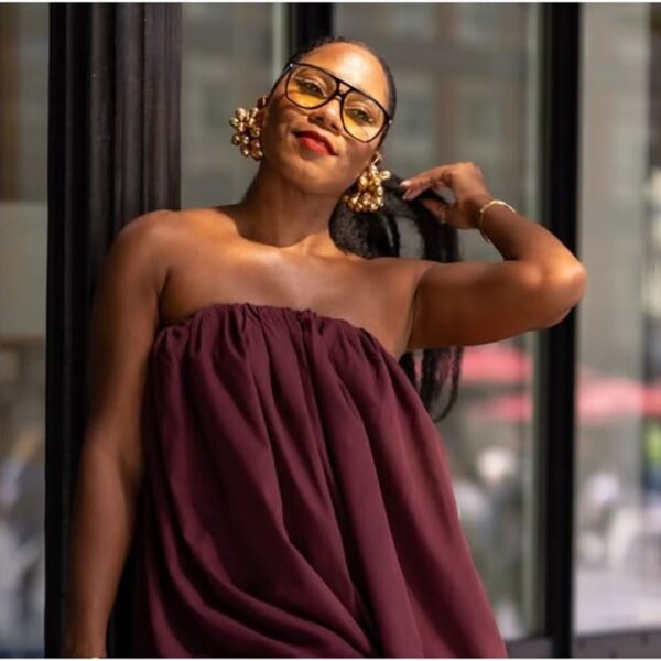 photo of a beautiful black laby on a wine sleeveless bubble dress