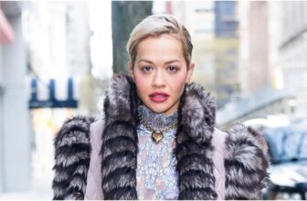 Photo of Rita Ora wearing lingerie-inspired mini dress under a fur coat on New Year's Eve Day, Wednesday, 2025