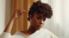 photo of a woman with curly hair - Fashion Police Nigeria