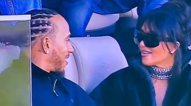 Photo of Kim Kardashian and Lewis Hamilton sitting together at the 2026 Super Bowl